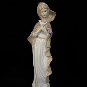 Vintage, Porcelain sculpture/figurine of a woman holding a dove.